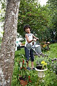 Watering plants in garden