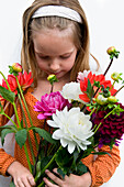 Girl holding Dahlias