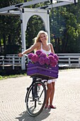 Woman with bike in park