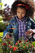 Girl with basket Dianthus red