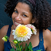 Woman holding dahlia