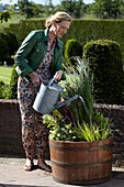 Woman watering container