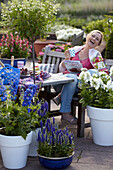 Woman sitting at garden table