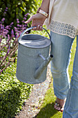Woman holding watering can