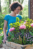 Woman looking at spring container