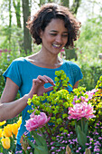 Woman looking at spring flowers