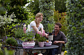 Woman decorating garden table