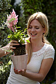 Woman holding Astilbe