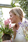 Woman smelling Astilbe