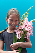 Girl holding Gladiolus