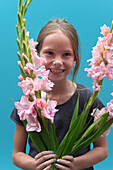 Girl holding Gladiolus