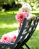 Girl holding dahlia