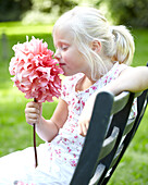 Girl holding dahlia