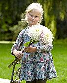 Girl holding dahlia