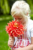 Girl holding dahlia