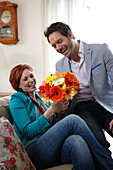 Couple holding flowers