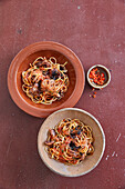 Mini pulpo braised in tomato sauce with linguine