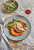 Braised shoulder of lamb with garlic cloves and tomato polenta