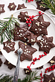 Vegan gingerbread with dark icing and almonds