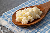 Plant milk kefir crystals on a wooden spoon