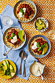 Three-bean chilli with rice and avocado