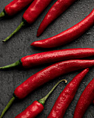 Red chillies on a grey background