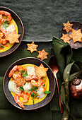 Exotic coconut cream soup with prawns and wantan stars