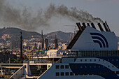 Cruise ship in port expelling smoke