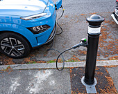 Electric car at pavement charging point