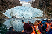 Tourists on cruise at Alsina Glacier, Chile