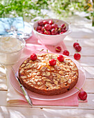 Cherry cake with almonds, cut into pieces