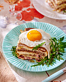 Buckwheat crêpe lasagne with cheese and fried egg