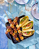 Banana and meat skewers and vegetable fajitas