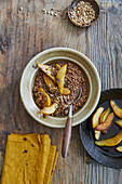 Warm buckwheat and cocoa porridge with caramelised pears