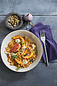 Wheat risotto with pumpkin, figs and blue cheese