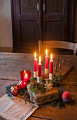 Wooden table decorated for Christmas with DIY Advent wreath