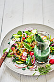 Mixed salad with savoury spirulina dressing