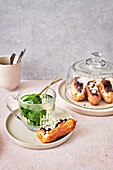 Homemade eclairs served with mint tea