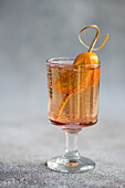 Summer cocktail, vodka with tonic and kumquat