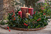 Advent wreath with red winterberry (Ilex verticillata), holly 'Blue Prince' (Ilex meserveae)