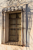Detail of a window with shadows at the Mission San Xavier del Bac, Tucson Arizona.