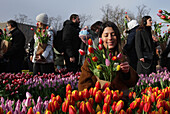 Thousands of people picked free tulips during the National Tulip Day at the Museum Square near Rijskmuseum on January 20, 2024 in Amsterdam, Netherlands. Today marks the official start of tulip season with a special tulip picking garden where people can pick tulips for free,. This year have an extra celebration, the 12th anniversary of the picking garden, organised by Dutch tulip growers, Amsterdam's Museum Square is filled with approximately 200,000 tulips. These tulips are specially arranged to make a giant temporary garden. Some more 1.7 billion Dutch tulips are expected to bring spring int