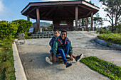 Dominican boys ride their homemade skateboard near Constanza in the Dominican Republic.