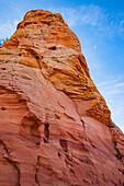 Moon over eroded Navajo sandstone formation in South Coyote Buttes, Vermilion Cliffs National Monument, Arizona.