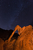 Milky Way over Elephant Rock, a natural arch in the eroded Aztec sandstone at night in Valley of Fire State Park in Nevada.