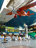 A reproduction of the 'Lituanica' hanging from the ceiling of the older Vilnius International Airport terminal in Lithuania. The Lituanica was a Bellanca CH-300 flown non-stop across the Atlantic from the United States to Europe in 1933 by two LIthuanian pilots.