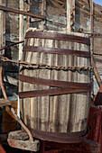 Wooden water barrel on an historic borax hauling wagon on display at Furnace Creek in Death Valley National Park in California.