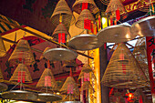 Burning incense coils send prayers to heaven in the Man Mo Temple, a Buddhist temple in Hong Kong, China.