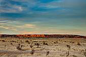 Colorful sunset clouds over a mesa on the high plains of eastern New Mexico.