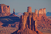 Telephoto view of the East Mitten & Utah monuments in Monument Valley from Hunt's Mesa in the Monument Valley Navajo Tribal Park in Arizona.